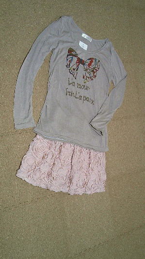 ７５）550円フリル付きリボントップス